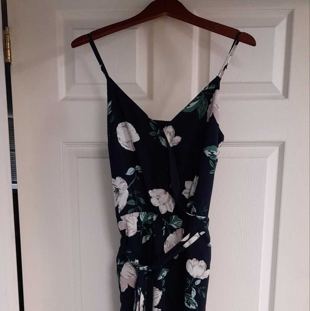 Wide leg pant jumpsuit with crossover top (button closure) and waist tie